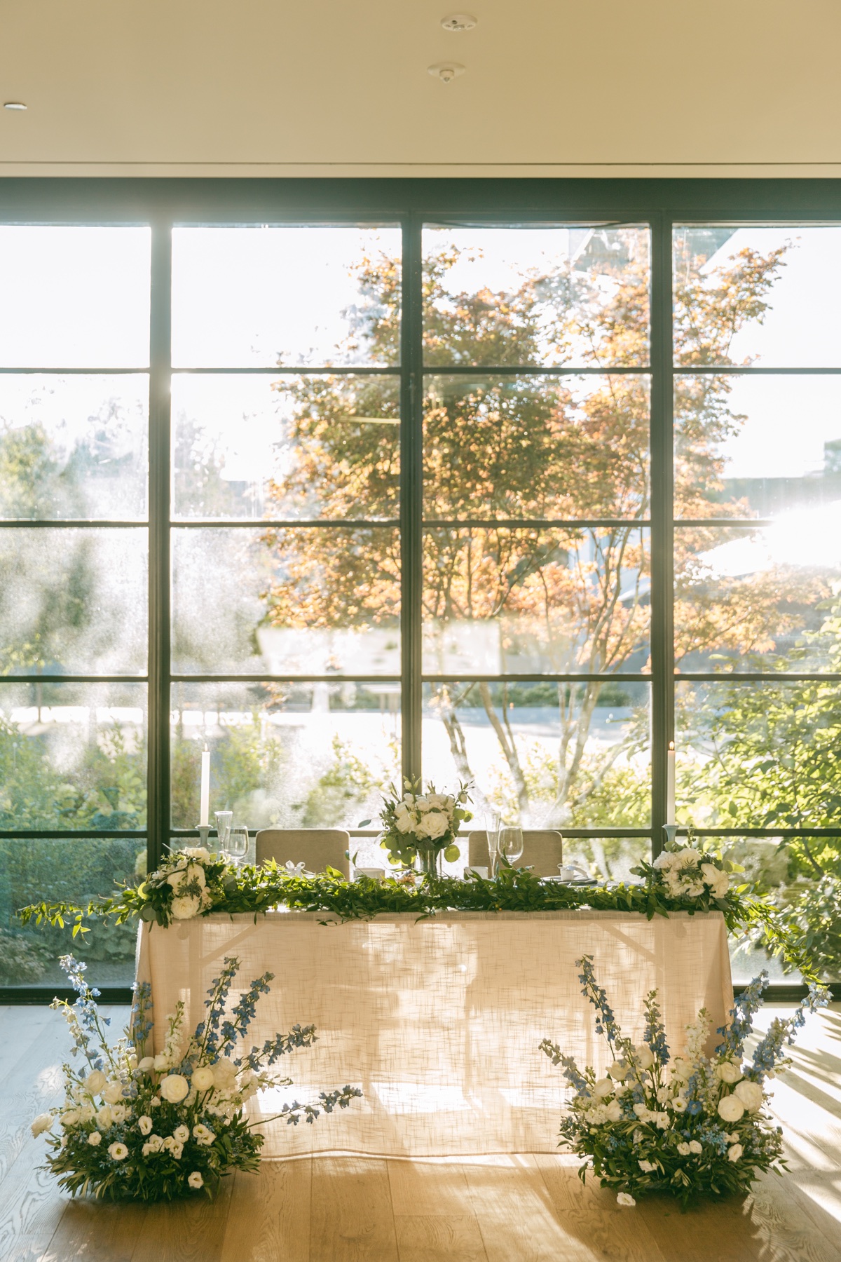 An intimate wedding table framed by warm window light