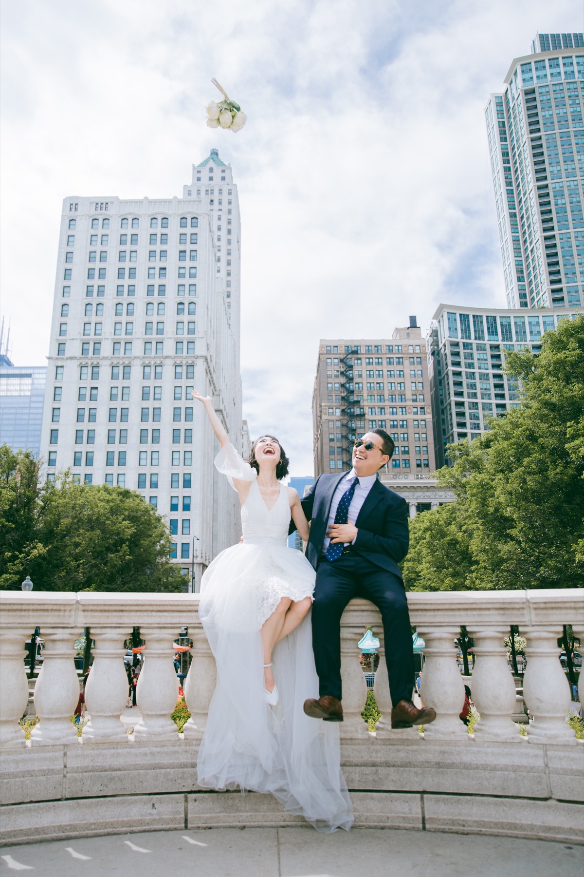 A joyful newlywed couple celebrating in downtown Chicago